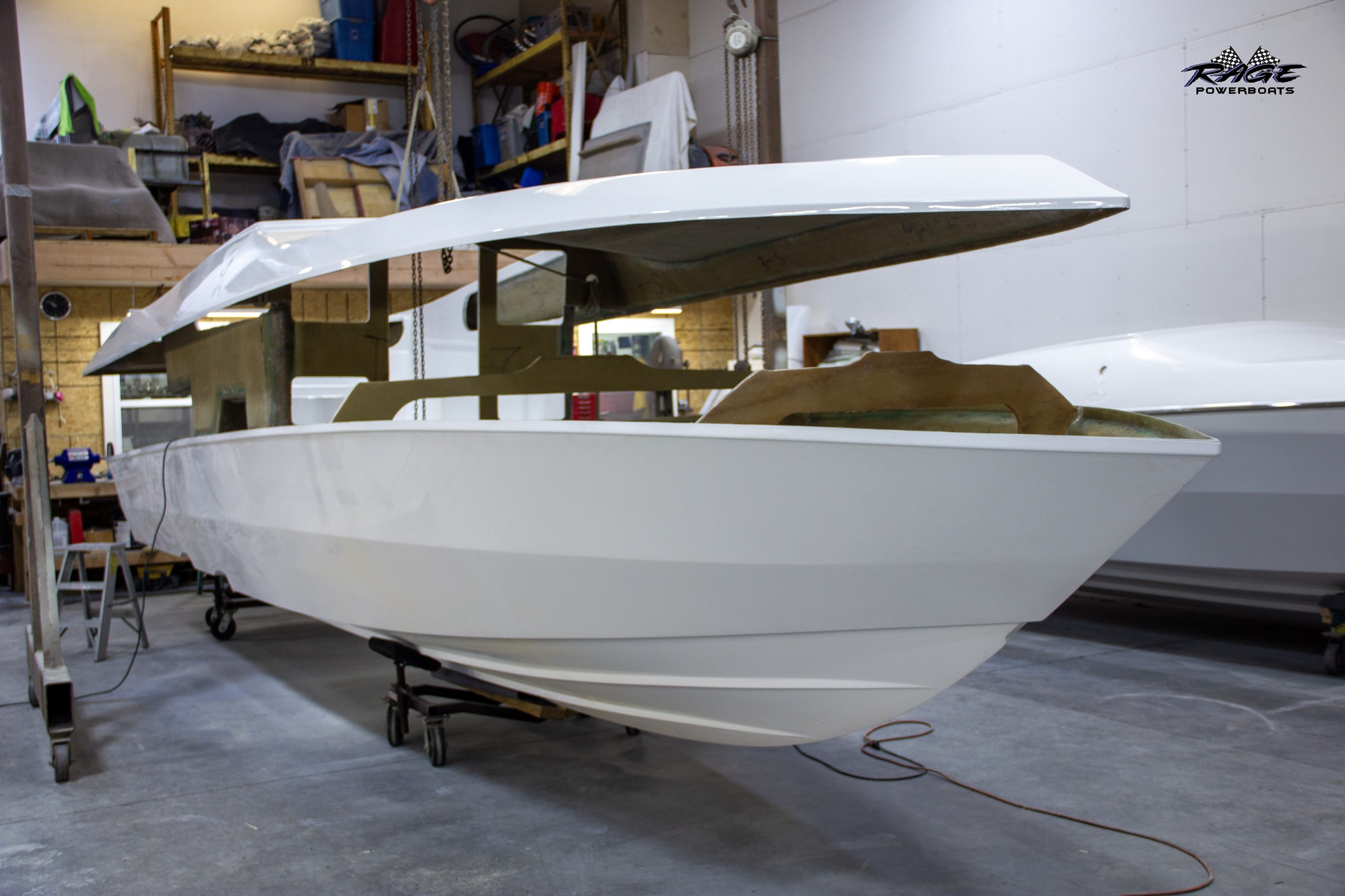 When the deck and the hull of the Rage 30 finally meet, it’s about more than just aesthetics—it’s the most critical structural step in the build.

The process, often called "deck-to-hull marriage," is where two separate fiberglass components become one rigid, high-performance unit. On a boat designed for the speeds and conditions of a Rage, this bond has to be perfect. We focus on a seamless integration where the liner, stringer system, and hull are chemically and mechanically bonded to ensure the boat handles like it's on rails.

Once that deck is set, the 30' silhouette is finally locked in, and the real transformation begins. It’s the backbone of everything we build.

#RagePowerboats #Rage30 #BoatBuilding #CustomBoats #OffshorePerformance #MarineEngineering #PowerboatDesign #HandBuilt
